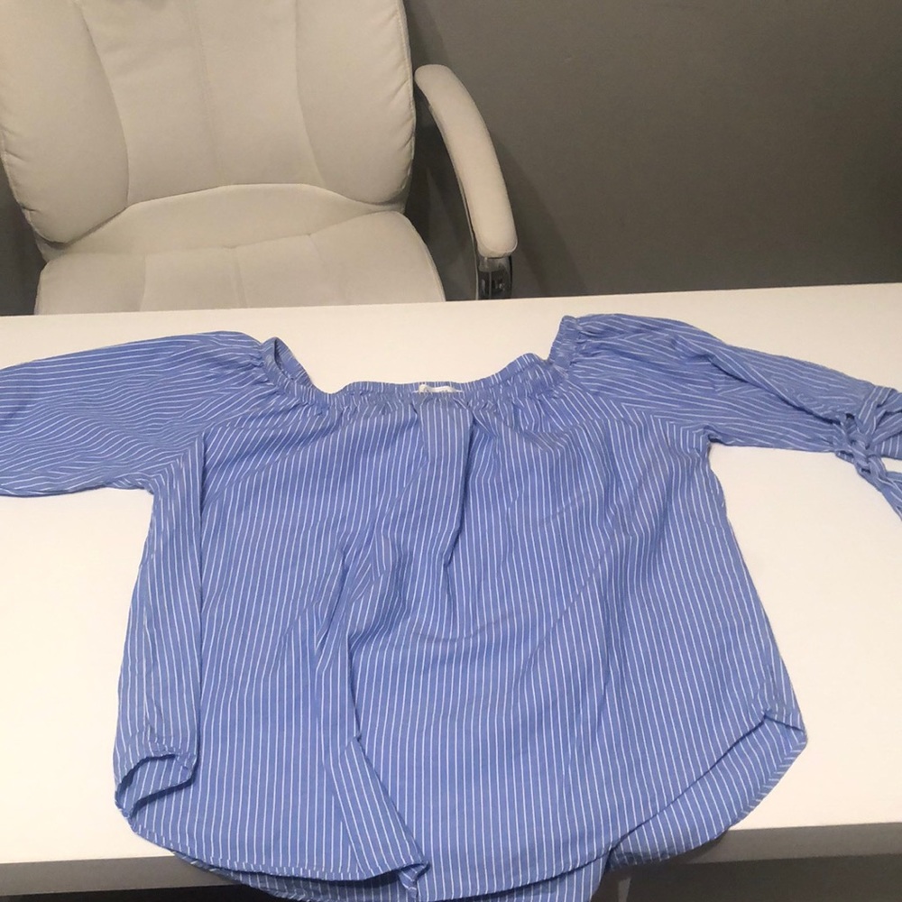 Blue and white vertical striped shirt. Off shoulder. Sleeves to elbowSize medium